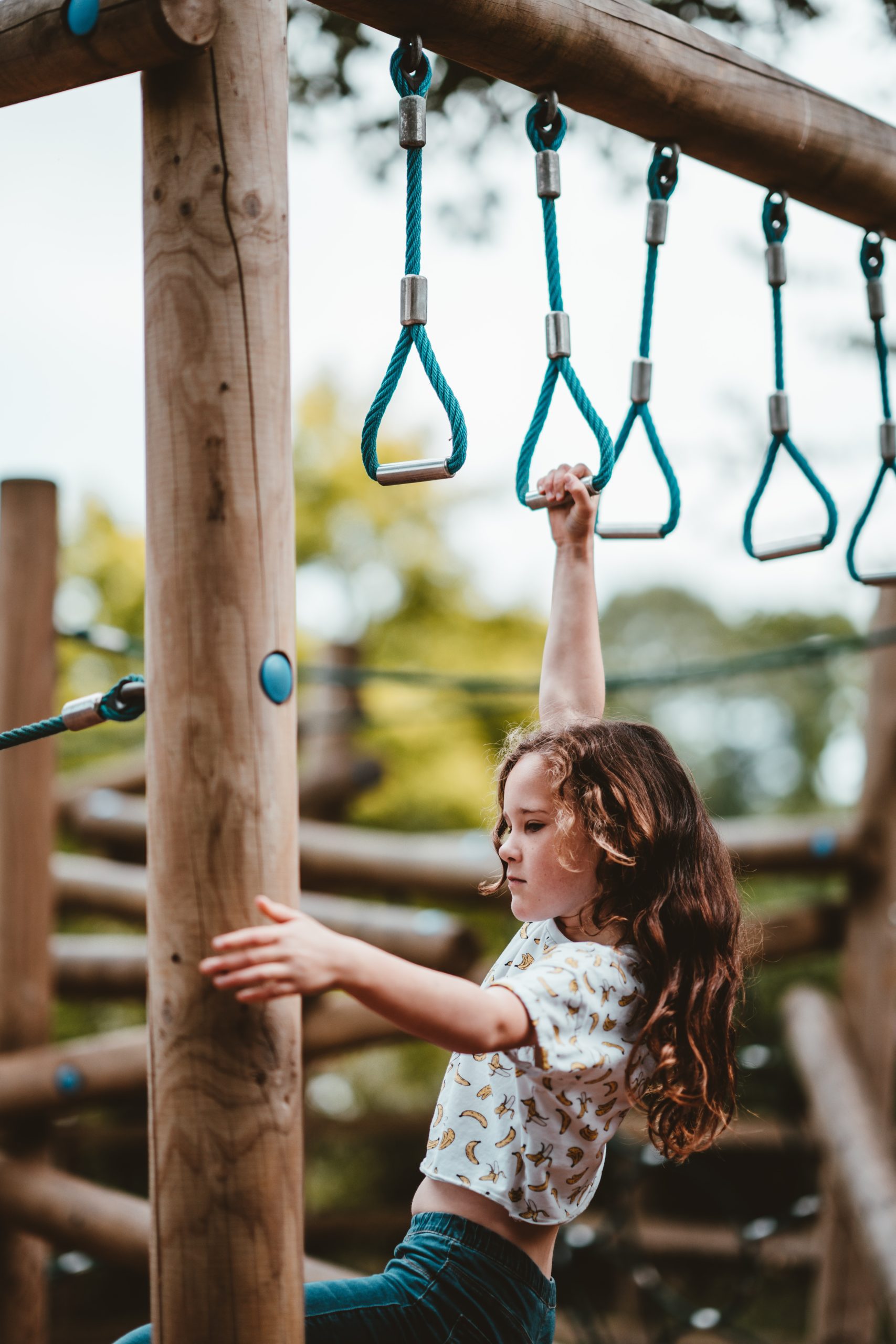 child doing heavy work on monkey bars child doing heavy work on monkey bars